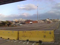 Just a propeller left standing, and the customs building